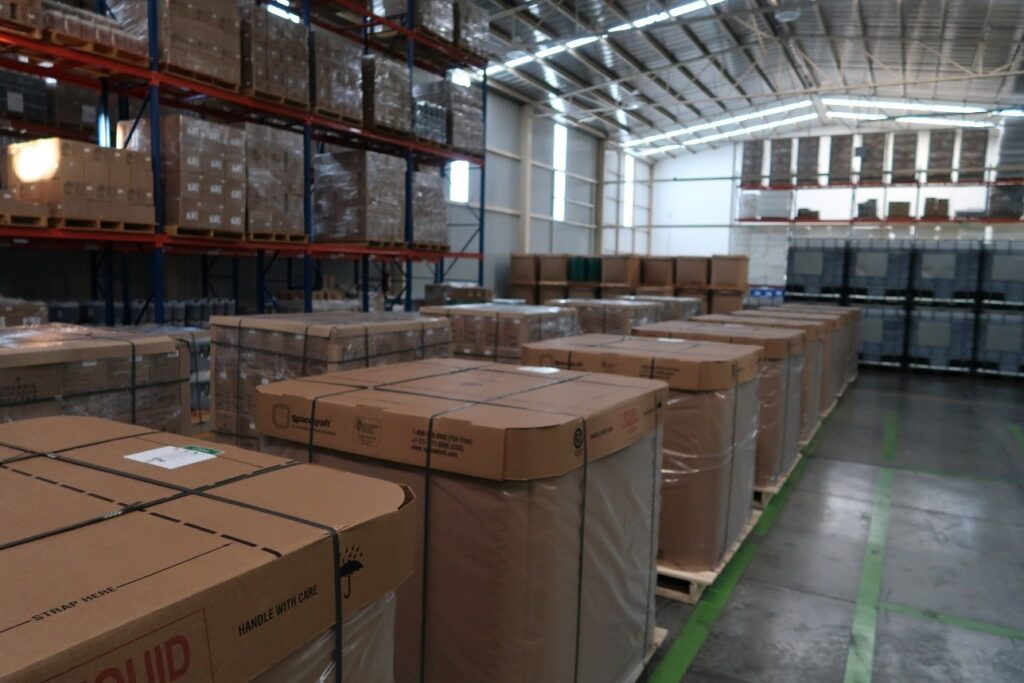 Agave syrup in cardboard totes